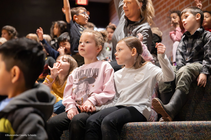 two friends holding hands