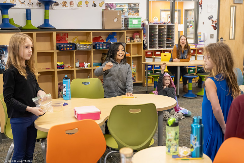 A student smiles during the presentation.