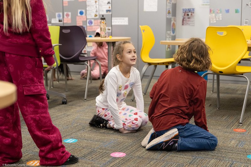 A student smiles during the presentation.