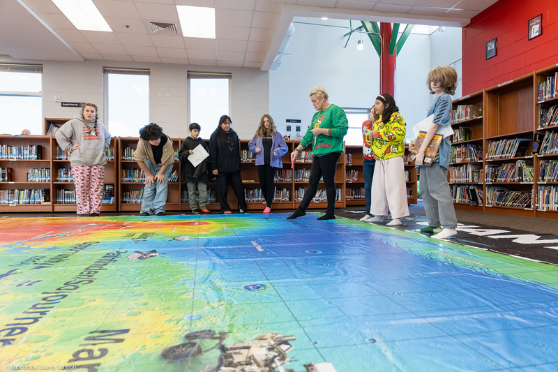 Haley Stamey and students explore the Giant Mars Map.