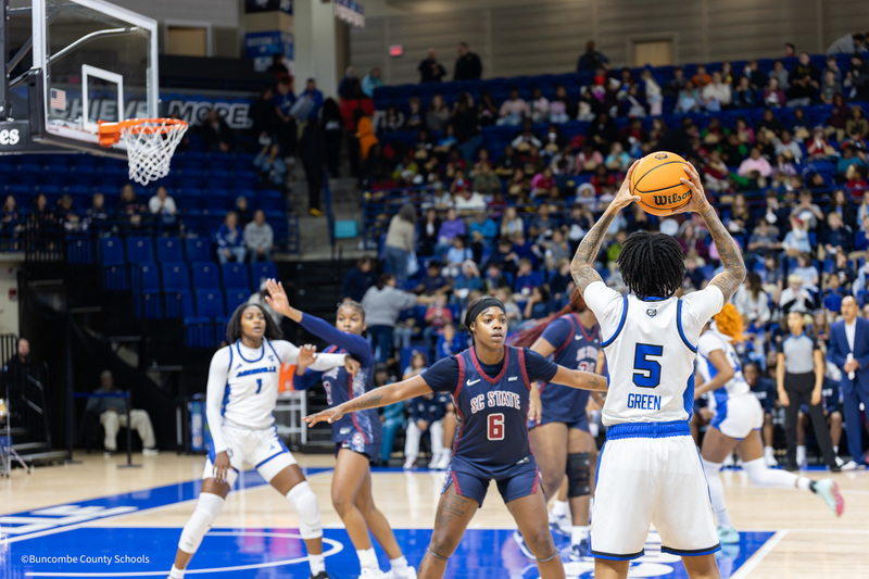 UNCA Womens Basketball Team playing on court