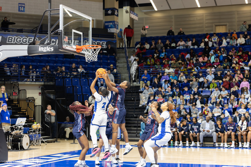 Women playing basketball