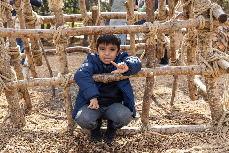 A student poses inside a troll design.