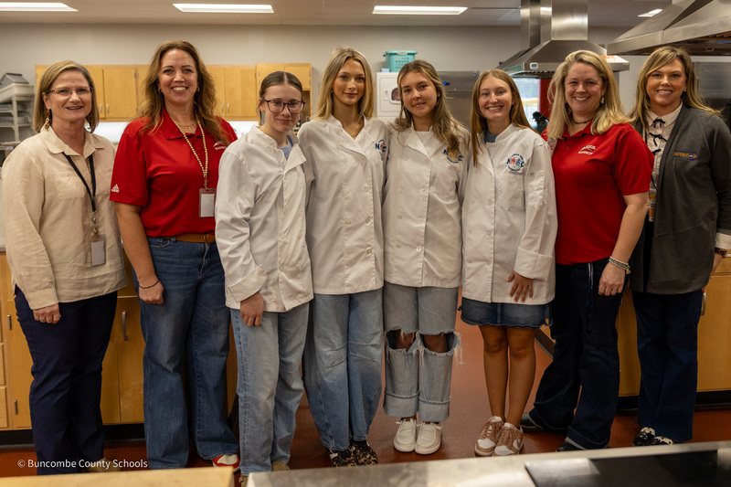 The Tastebud Trailblazers pose with their two teachers, BCS Nutrition director, and BCS CTE director.