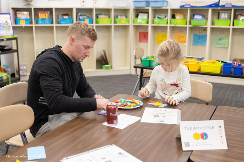 Student and parent playing a game