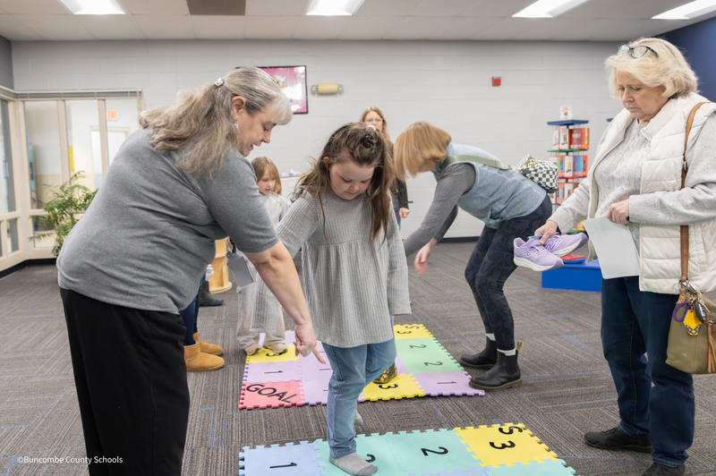 student playing hopscotch style game