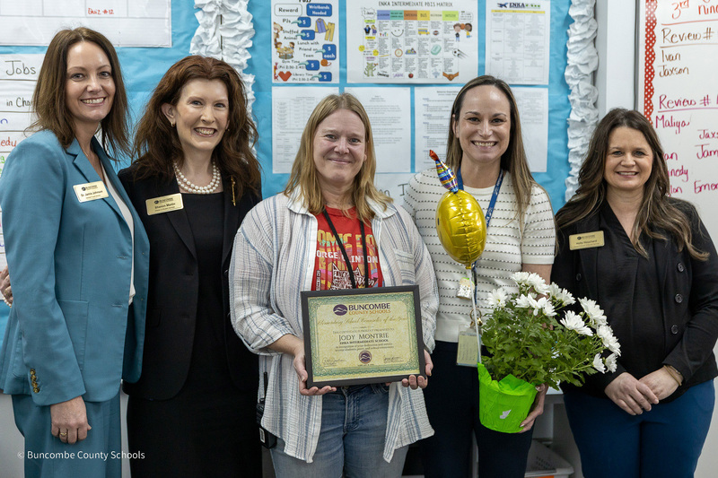 Dr. Johnson, Ms. Martin, Ms. Montrie, Principal Emily Cox, and Ms. Houchard pose for a photo.