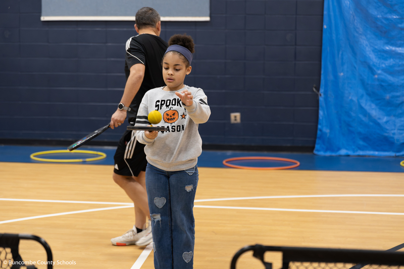 Student learning the fundamentals of pickleball.