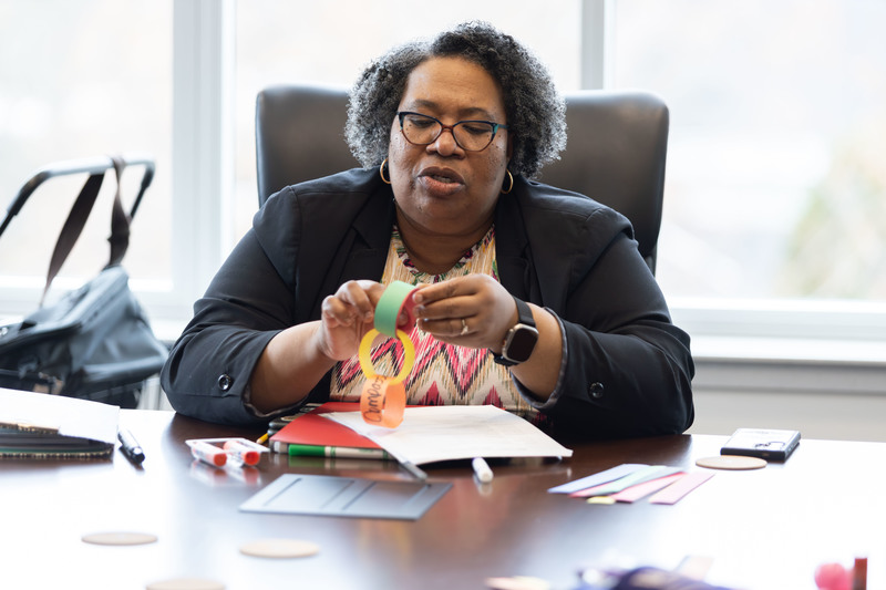 Teacher making paper chain