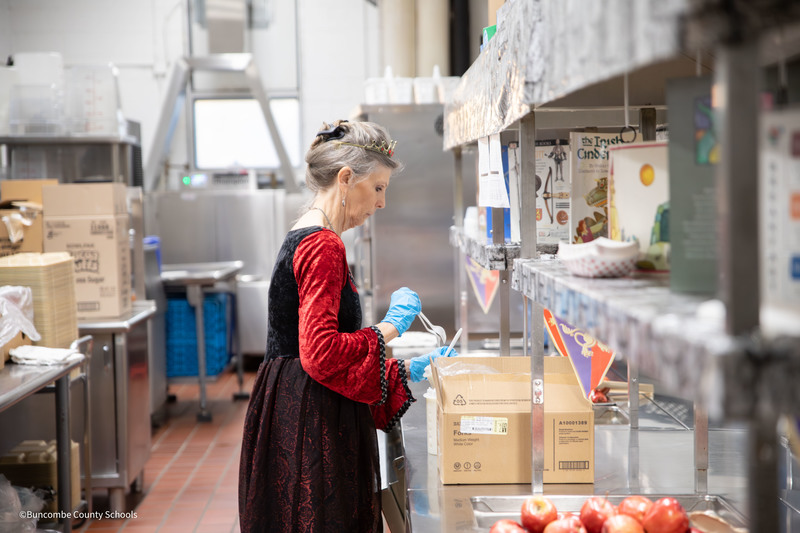 Child Nutrition Employee preparing meals for students 