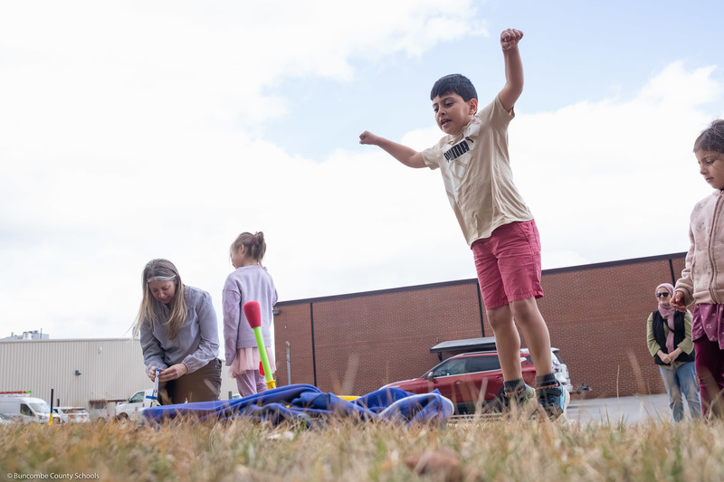 A student stomps on a rocket launcher.