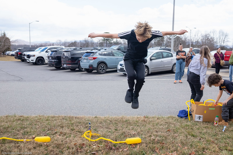 A student stomps on a rocket launcher.