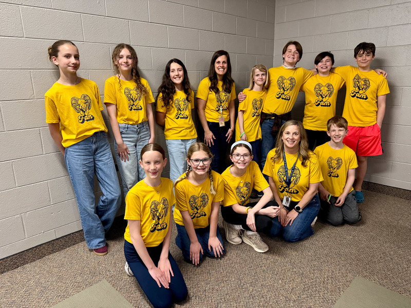 The third place Koontz Intermediate team poses with certificates and medals.