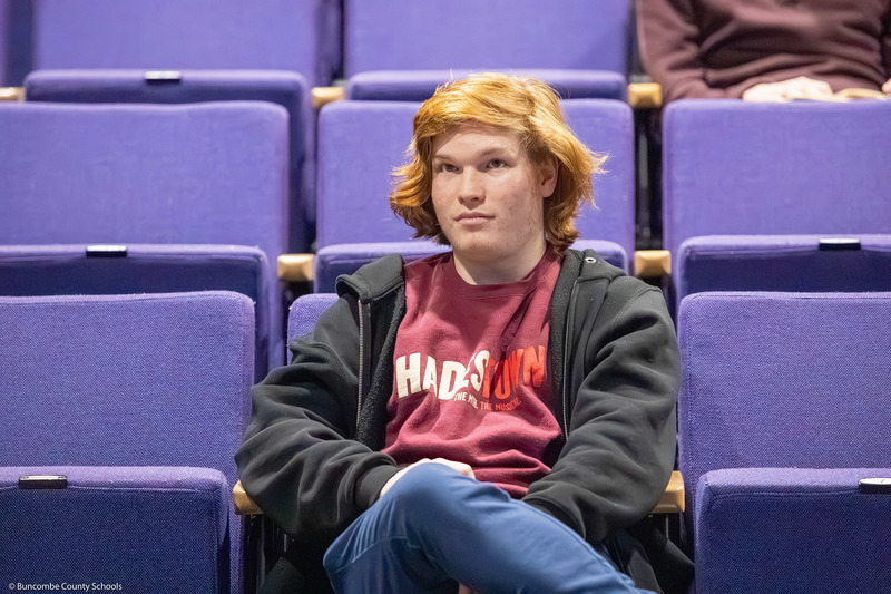 A participating student listens as a question is read.