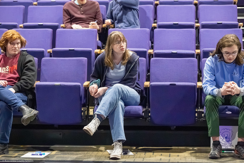 A participating student listens as a question is read.