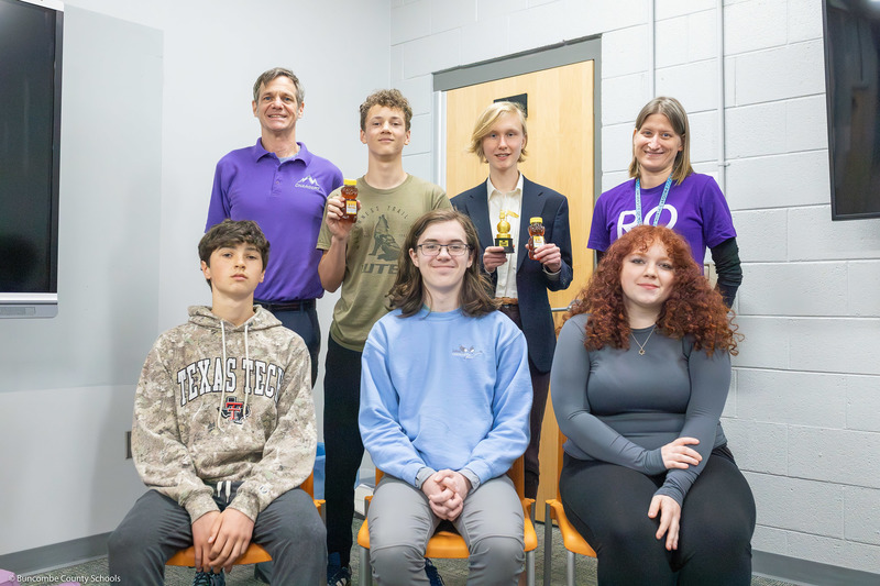 Social studies teacher Charlie Lanahan and math teacher Misti McDaniel pose with students who participated in the Geography Bee.
