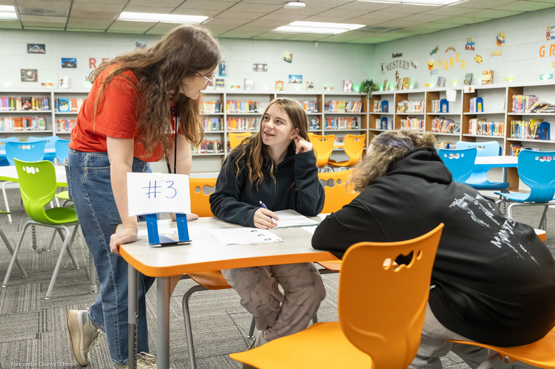 Students talk to Erwin Middle media coordinator Malorie Hudson. 