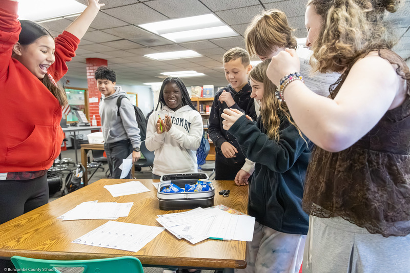 Students celebrate opening the final breakout box.
