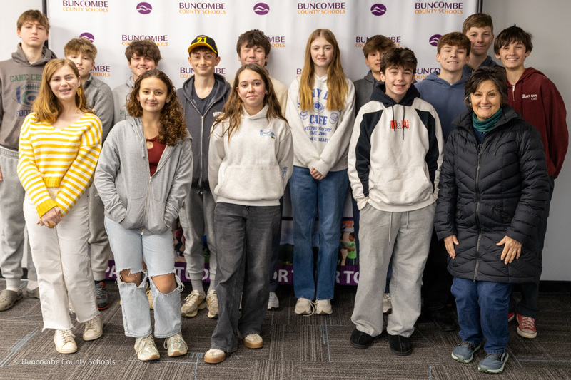 The Cane Creek MathCounts team poses for a photo in front of the Buncombe County Schools banner.