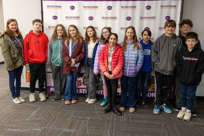 The North Windy Ridge MathCounts team poses for a photo in front of the Buncombe County Schools banner.