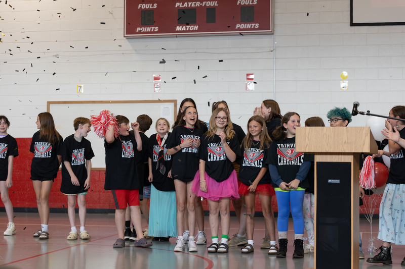 Members of the Fairview student news team stand as confetti falls