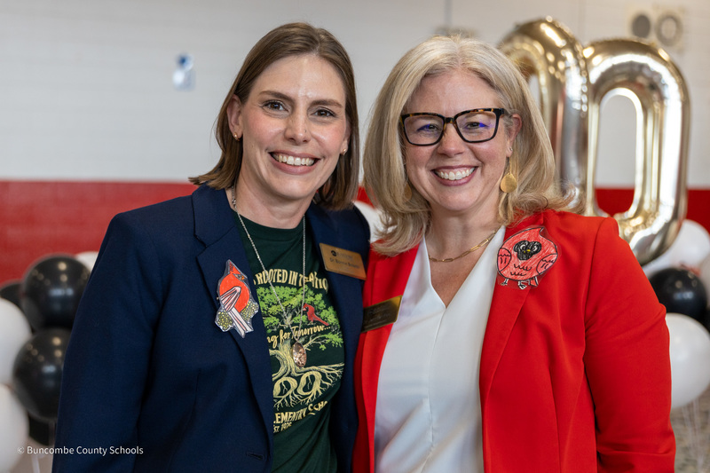 Dr. Bolado and Dr. Reed pose, wearing their cardinal lapel pins.