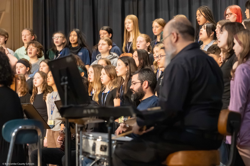 Middle School All-County Chorus members practice before the performance.