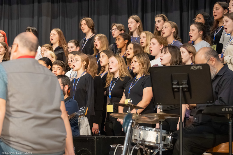 Middle School All-County Chorus members practice before the performance.