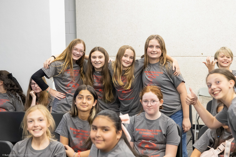 Four elementary/intermediate students pose for the camera.