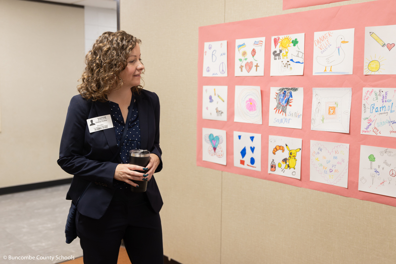 Rep. Prather looks at artwork posted in the hallway of Glen Arden Elementary.