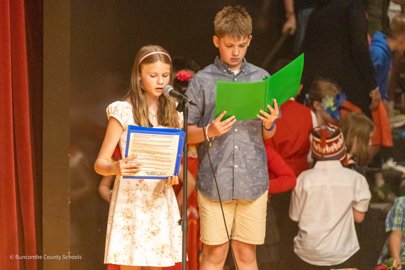 The narrators introduce each segment of the program in English and Spanish.