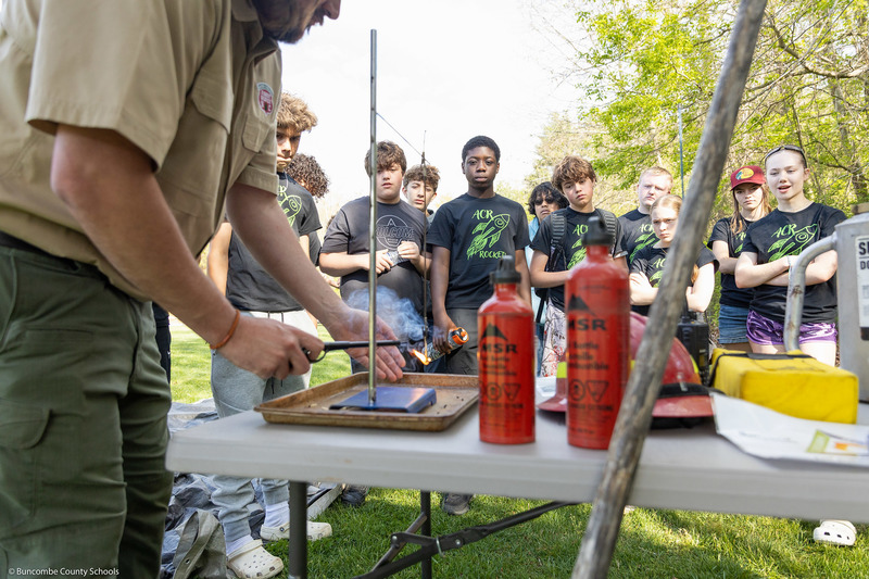A North Carolina Forest Service representative demonstrates fire behavior to students.