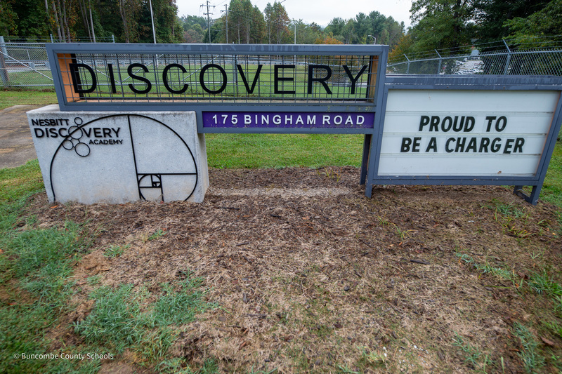 A photo of the Nesbitt Discovery Academy sign. It reads "Proud to be a Charger".