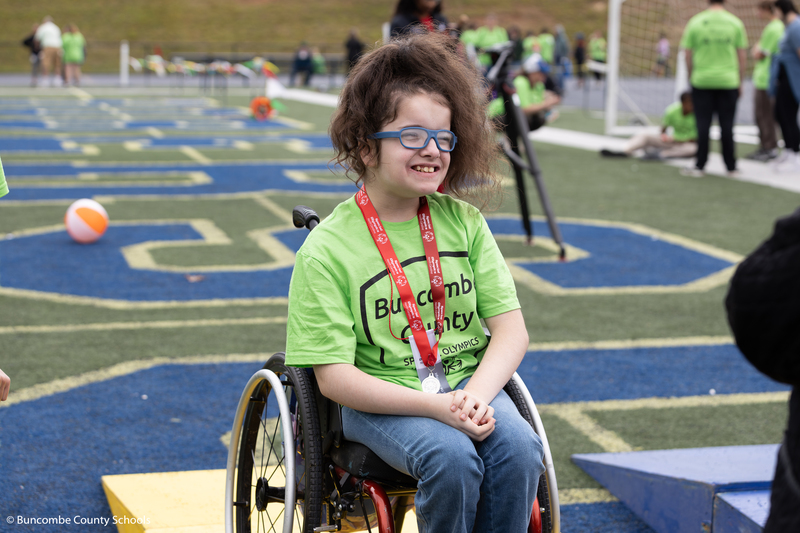 Student receiving medal for a race she participated in. 