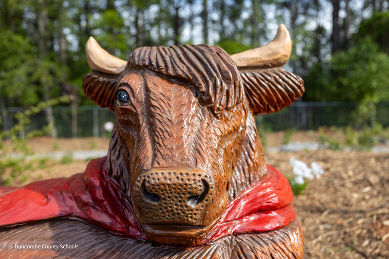 A close-up view of the head of the cow sculpture.