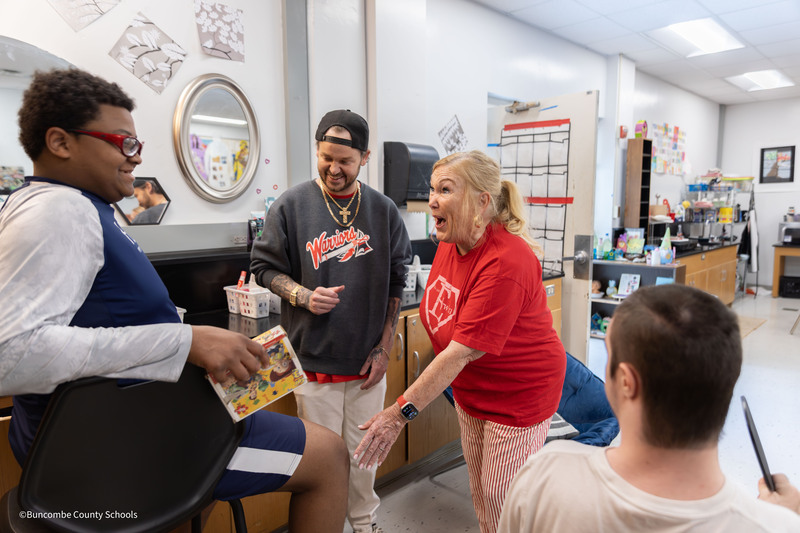 Kim and Tyler greet students