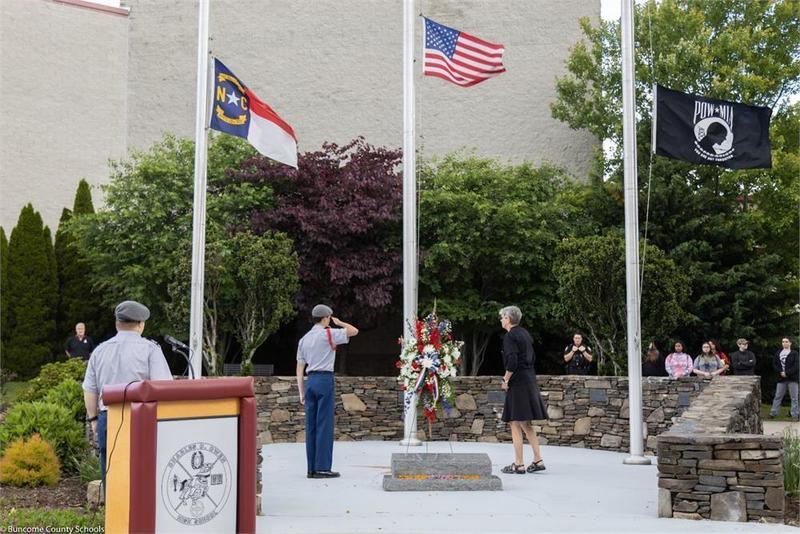 ROTC students saluting the flag