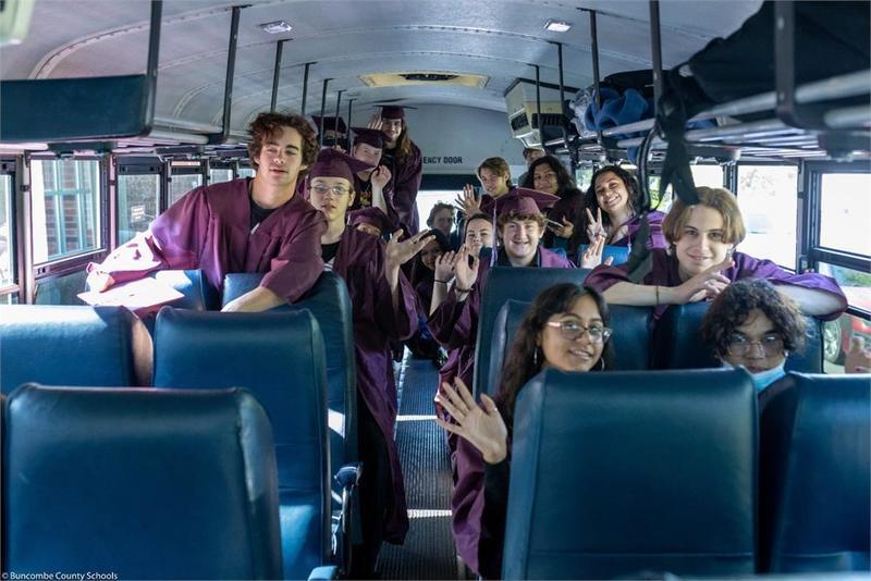 Graduates in a school bus Graduates in a school bus