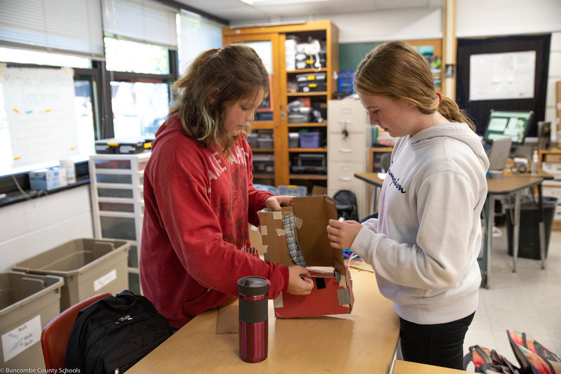 Girls working on the final build of their walking boot.