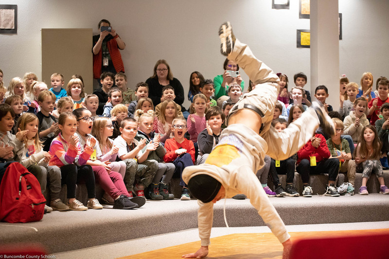 Guest performer showing students a break dance.