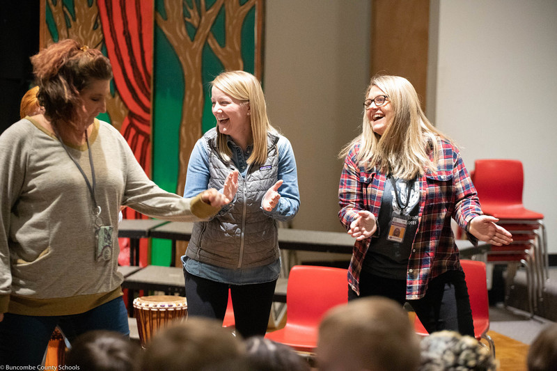 Teachers doing a dance for the students. 