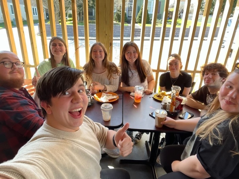 North Buncombe students and Danish students enjoying a meal together.