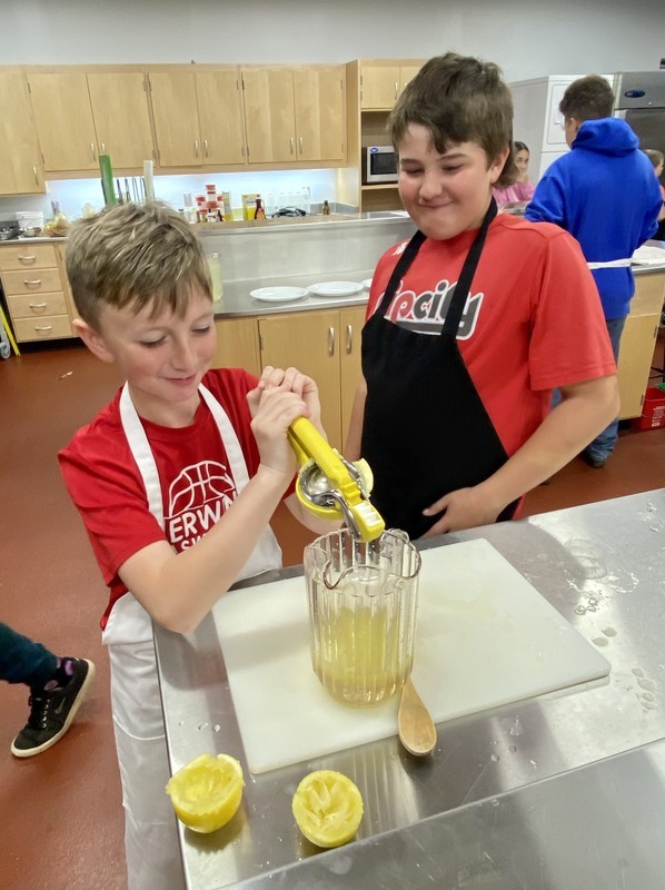 Student making freshly squeezed lemonade.