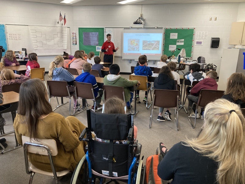 Students learning from scientist from NOAA.