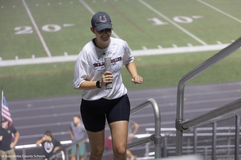 Volleyball coach climbing the stairs. 