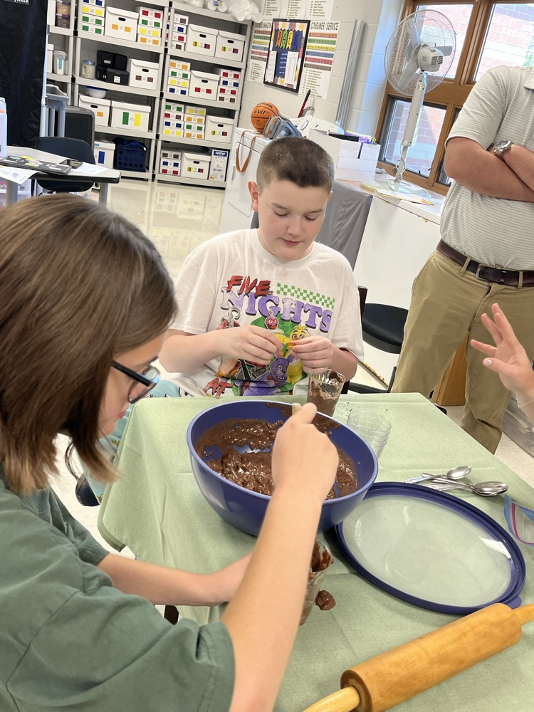 Vere and Sophie dishing their dirt and worms (pudding).