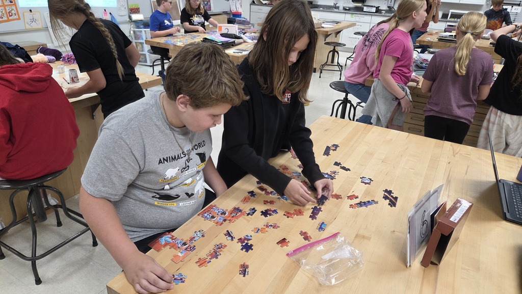 Students working on a puzzle together.