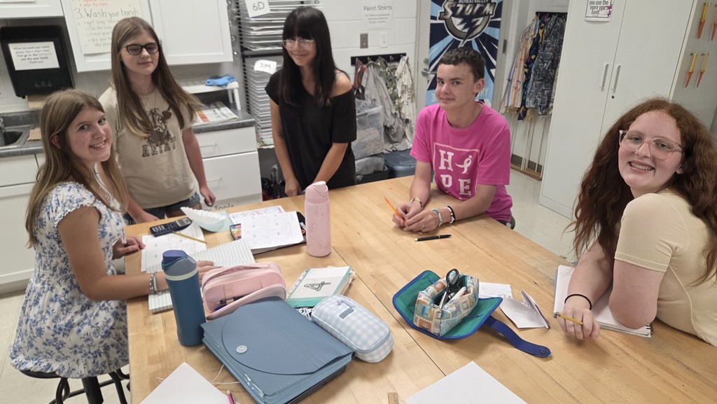 Students working on t-shirt contest designs. 