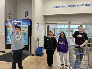 Students are walking into a grocery store.