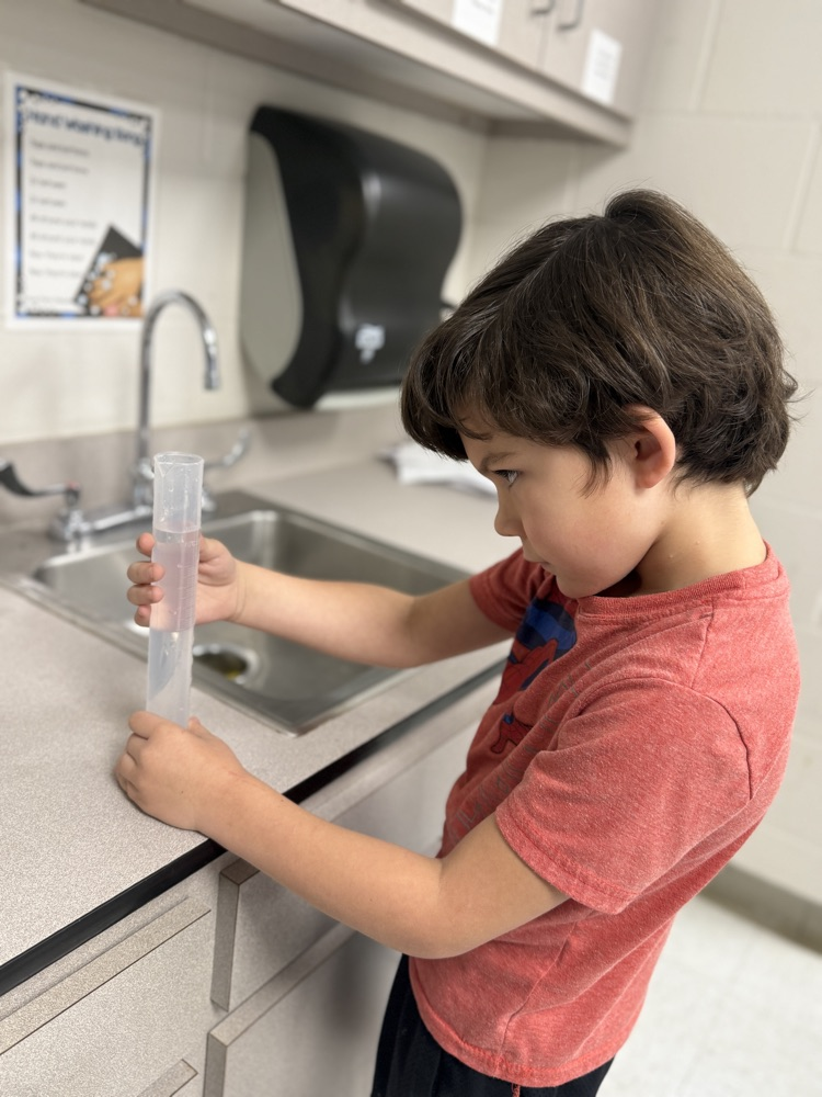 Second graders learn how to use graduated cylinders in STEM Class with Mrs. Morgan 